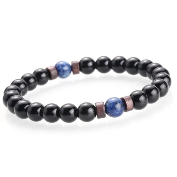 Men's hand wearing natural moonstone beaded bracelet